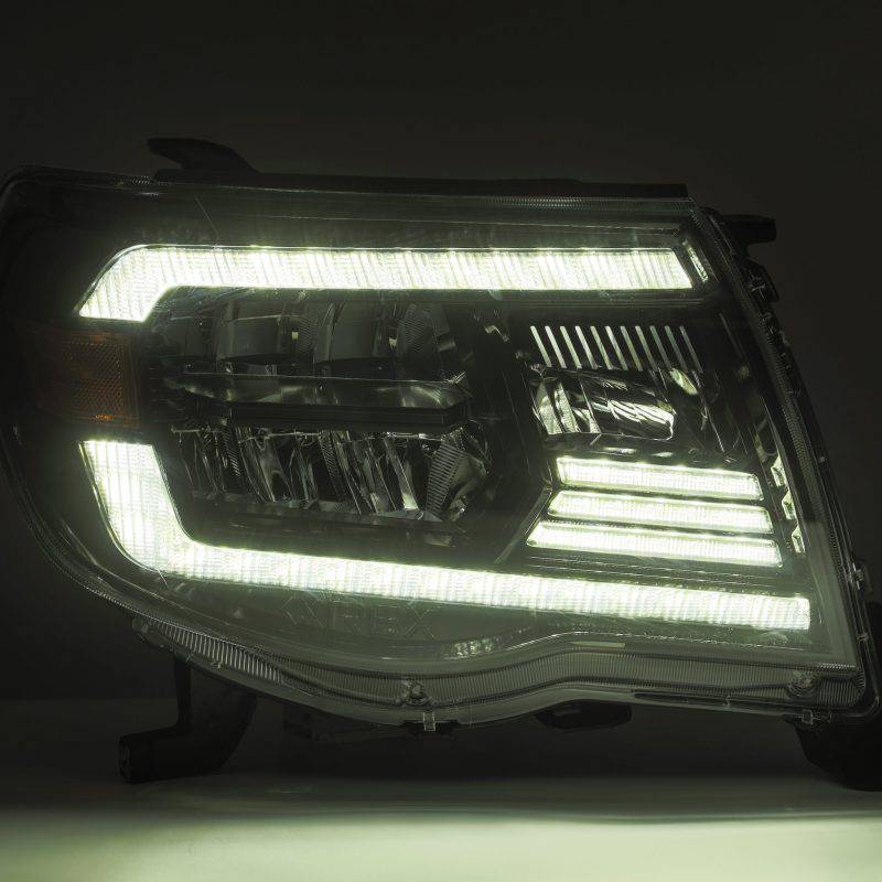 AlphaRex 05-11 Toyota Tacoma LUXX Crystal Headlights Plank Style Alpha Black w/Activation Light/DRL - Striker Modified