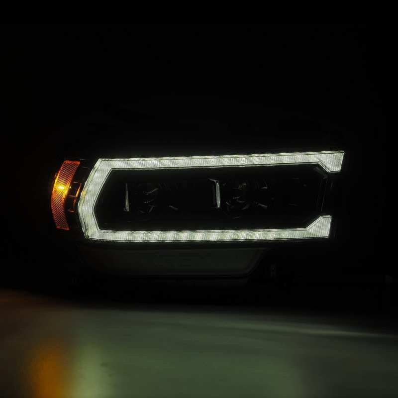AlphaRex 19-21 Ram 2500 PRO-Series Projector Headlights Plank Style Alpha Black w/Activation Light - Striker Modified