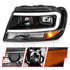 ANZO 99-04 Jeep Grand Cherokee Crystal Headlights - w/ Light Bar Black Housing - Striker Modified