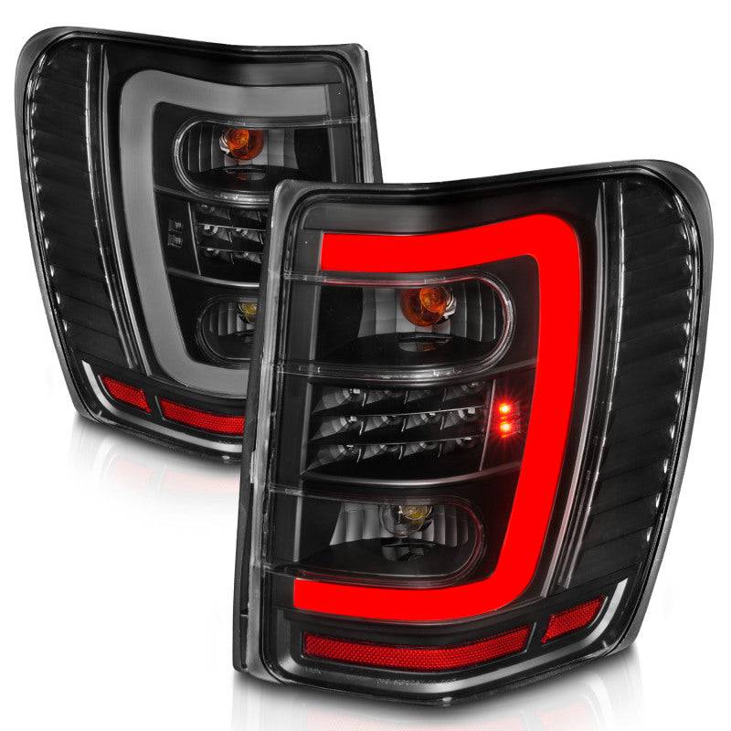 ANZO 1999-2004 Jeep Grand Cherokee LED Tail Lights w/ Light Bar Black Housing Clear Lens - Striker Modified