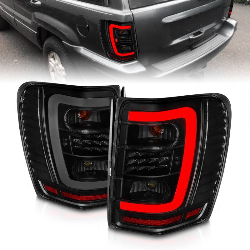 ANZO 1999-2004 Jeep Grand Cherokee LED Tail Lights w/ Light Bar Black Housing Smoke Lens - Striker Modified