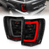 ANZO 1999-2004 Jeep Grand Cherokee LED Tail Lights w/ Light Bar Black Housing Smoke Lens - Striker Modified