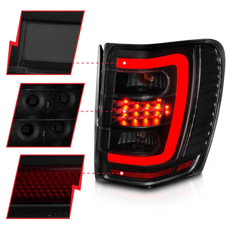 ANZO 1999-2004 Jeep Grand Cherokee LED Tail Lights w/ Light Bar Black Housing Smoke Lens - Striker Modified