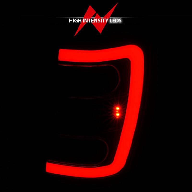 ANZO 1999-2004 Jeep Grand Cherokee LED Tail Lights w/ Light Bar Black Housing Smoke Lens - Striker Modified