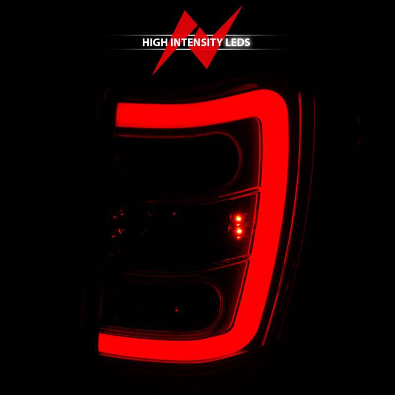 ANZO 1999-2004 Jeep Grand Cherokee LED Tail Lights w/ Light Bar Chrome Housing Red/Clear Lens - Striker Modified