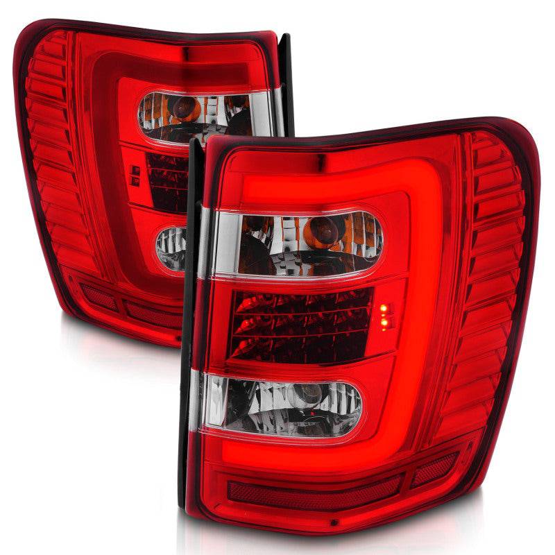 ANZO 1999-2004 Jeep Grand Cherokee LED Tail Lights w/ Light Bar Chrome Housing Red/Clear Lens - Striker Modified